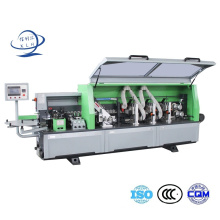 Fully Automatic Edge Trimming Machine and Plastic Sheets Masking Film Sticking in Plywood Machine White ABS Edge Tape Banding Machine with a Slight Stipple.